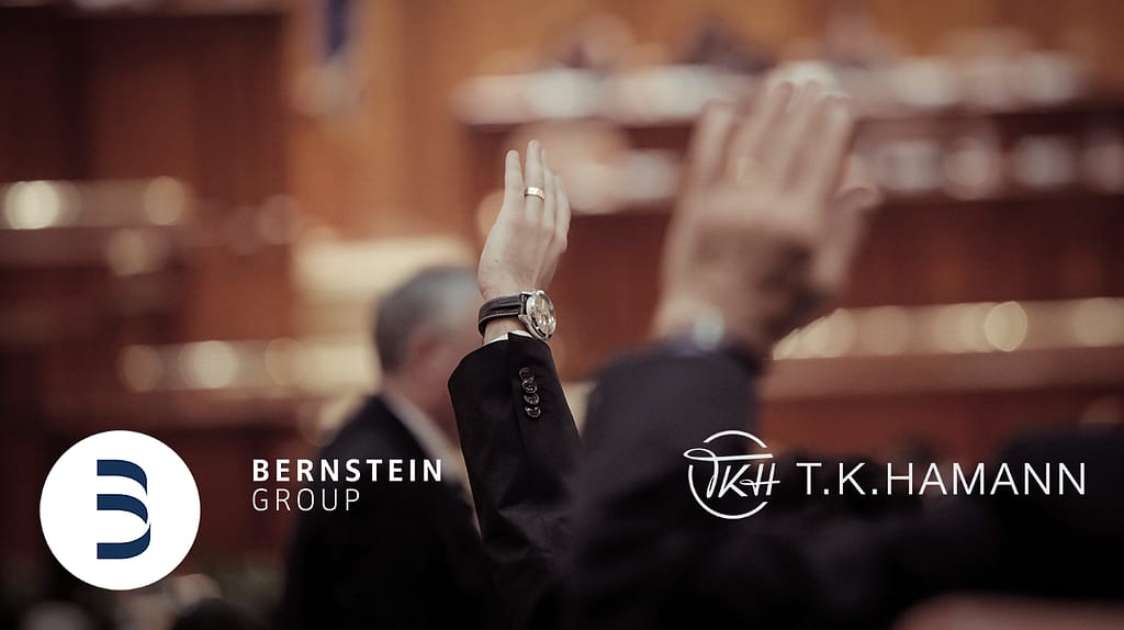 Bernstein Analytics corporate meeting vote with raised hands and governance discussion.
