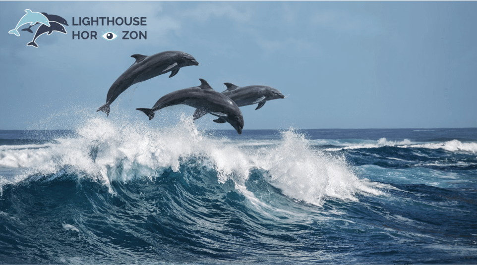 Dolphins leaping over ocean waves with Lighthouse Horizon corporate logo.